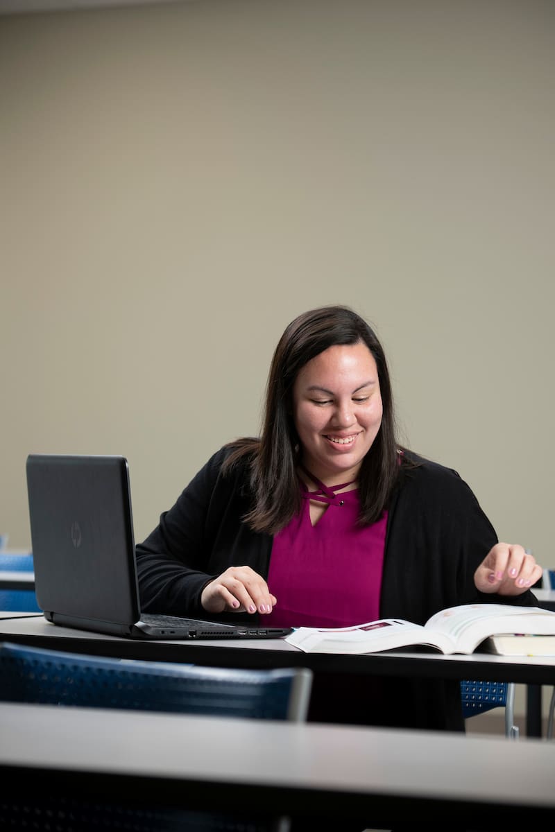 Student reading textbook