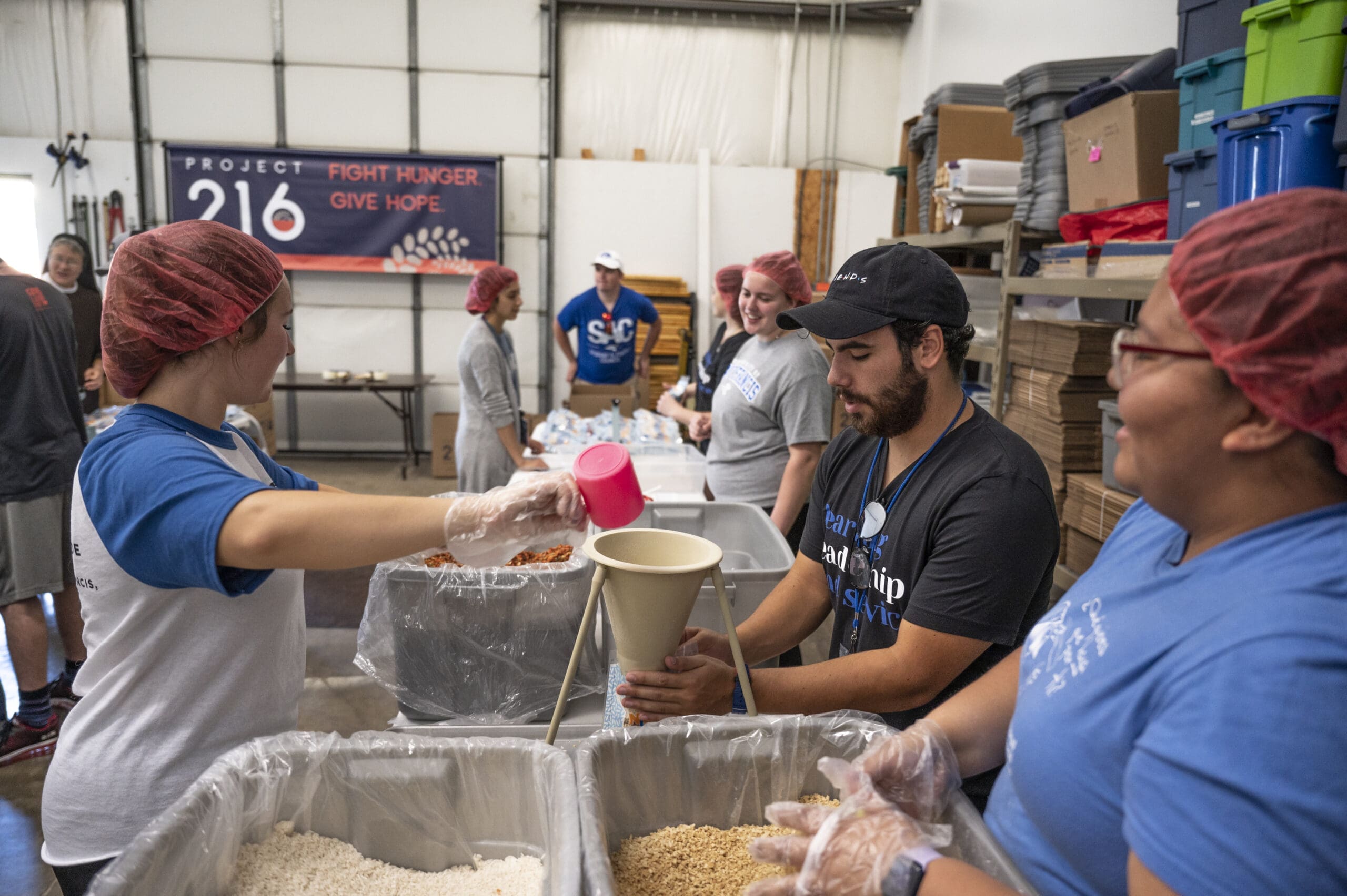 Students volunteering together at a fighting hunger event. 