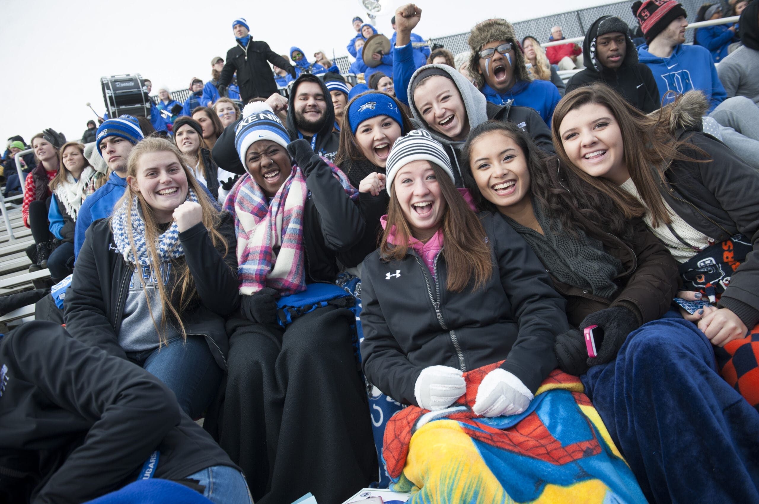 Students cheering at a Cougar Football game
