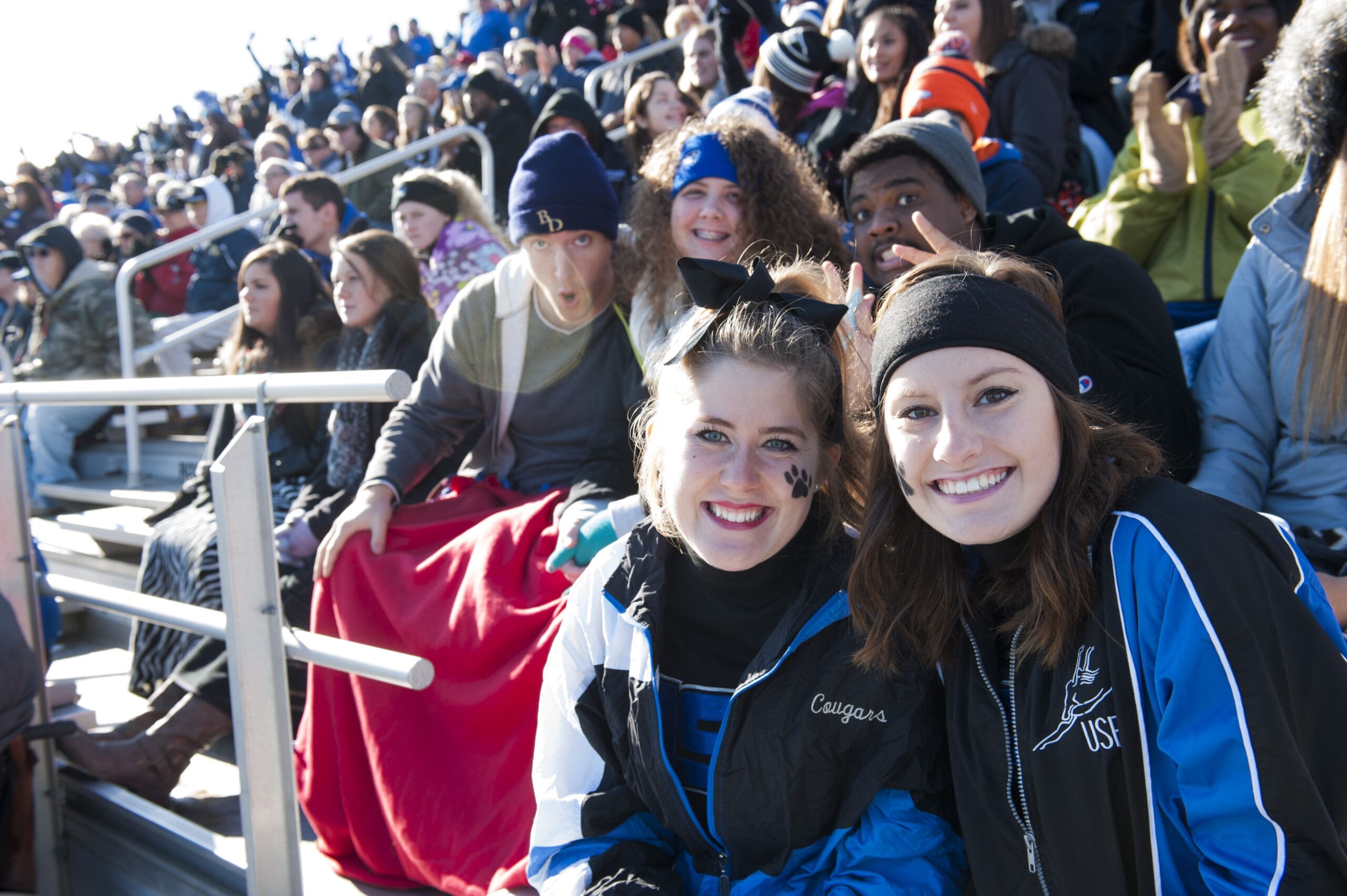 Students at a Cougar Football game. 