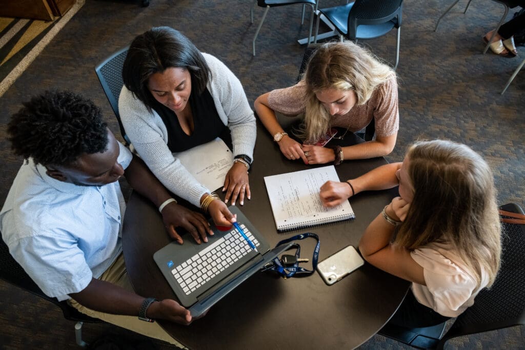 Students studying at large table