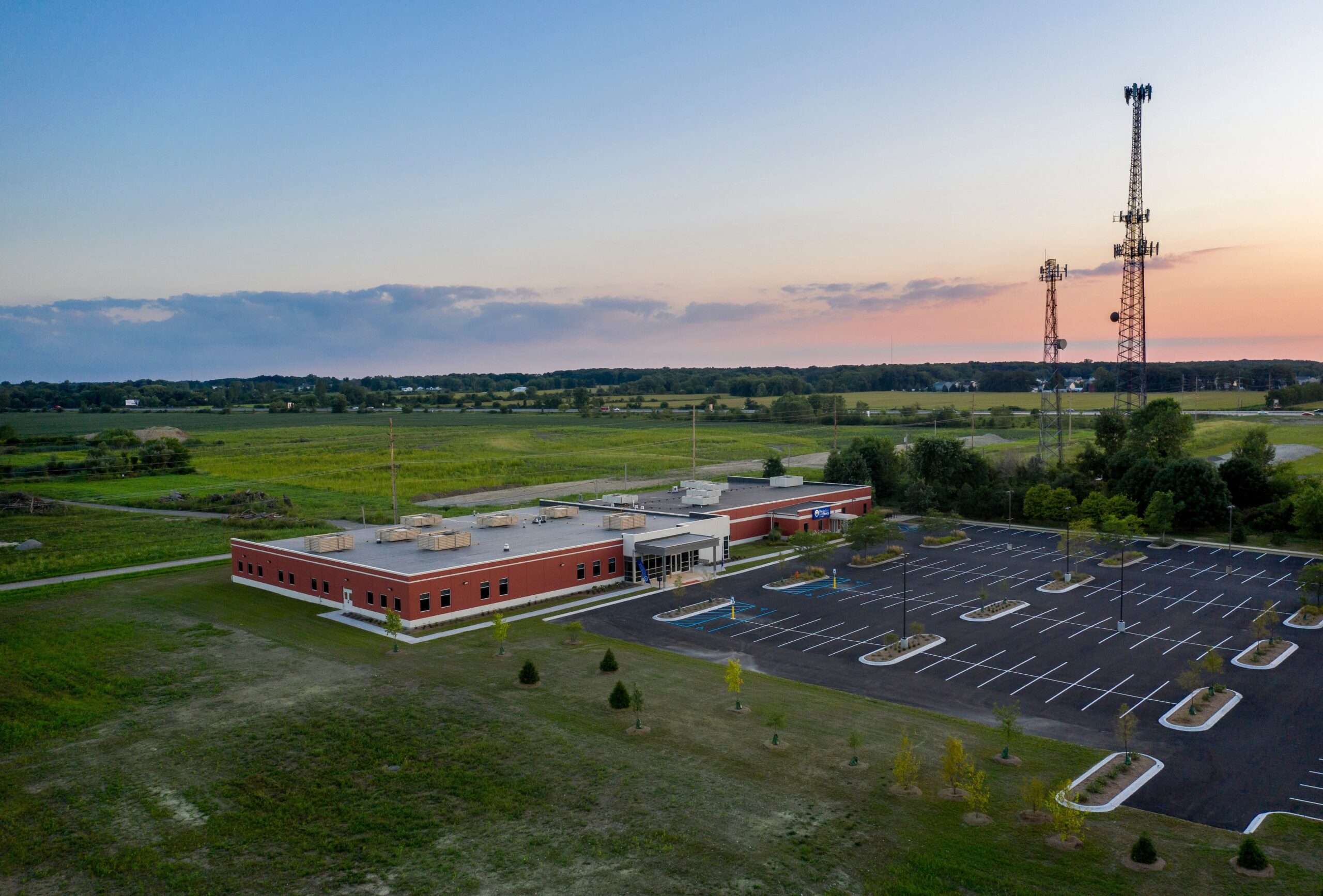 University of Saint Francis Crown Point building and parking lot from above during sunset.