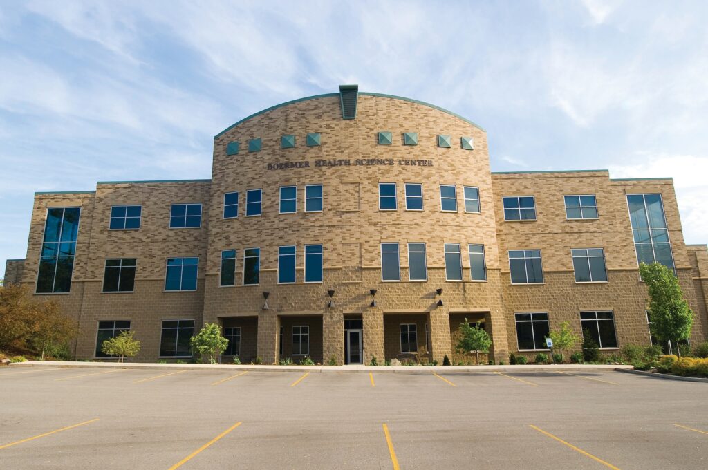 Doermer Health Sciences Center on a sunny day with clouds in the sky