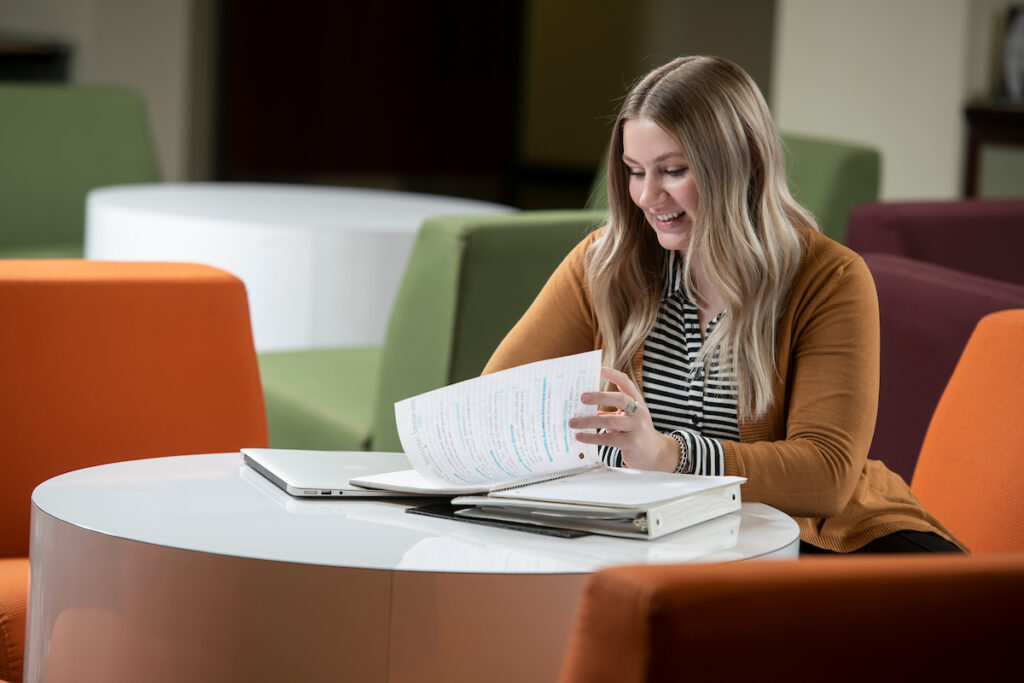 Psychology student studying in the library.