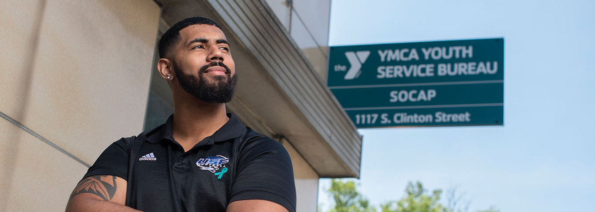 Cameron Shackelford standing outside the downtown Fort Wayne YMCA