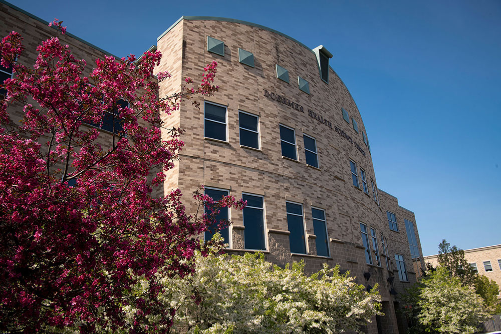 The backside of Doermer with red leaves from a tree in view