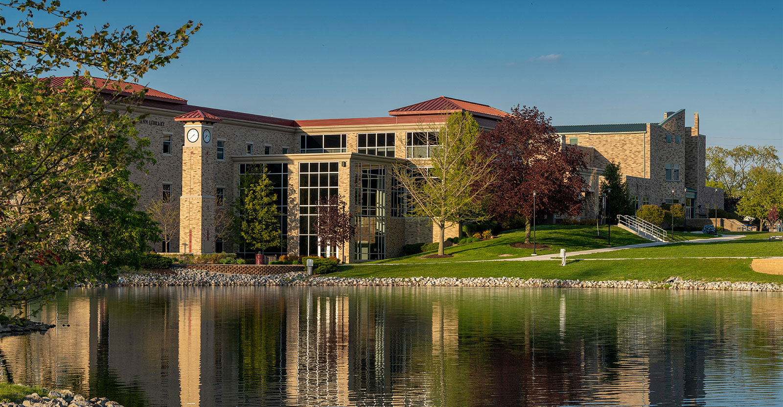 Pope John Paul II Center and clocktower on a sunny afternoon