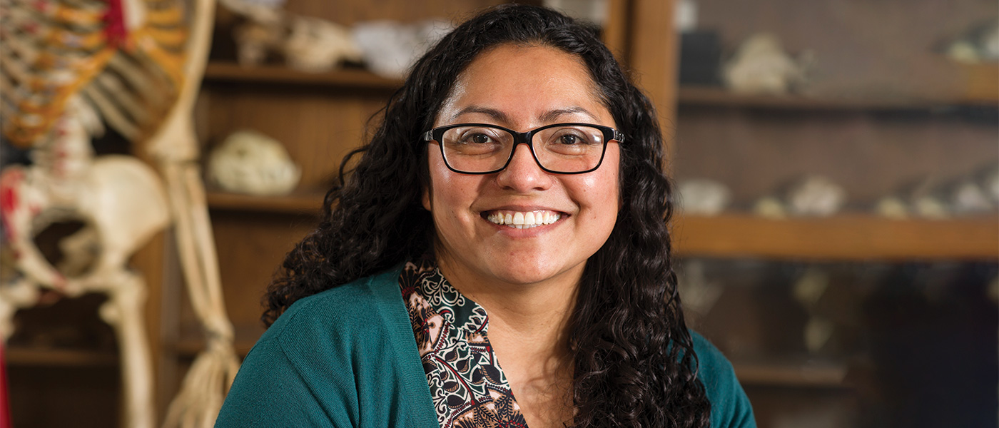 Paula Avila smiling at the camera in one of the science labs in Achatz