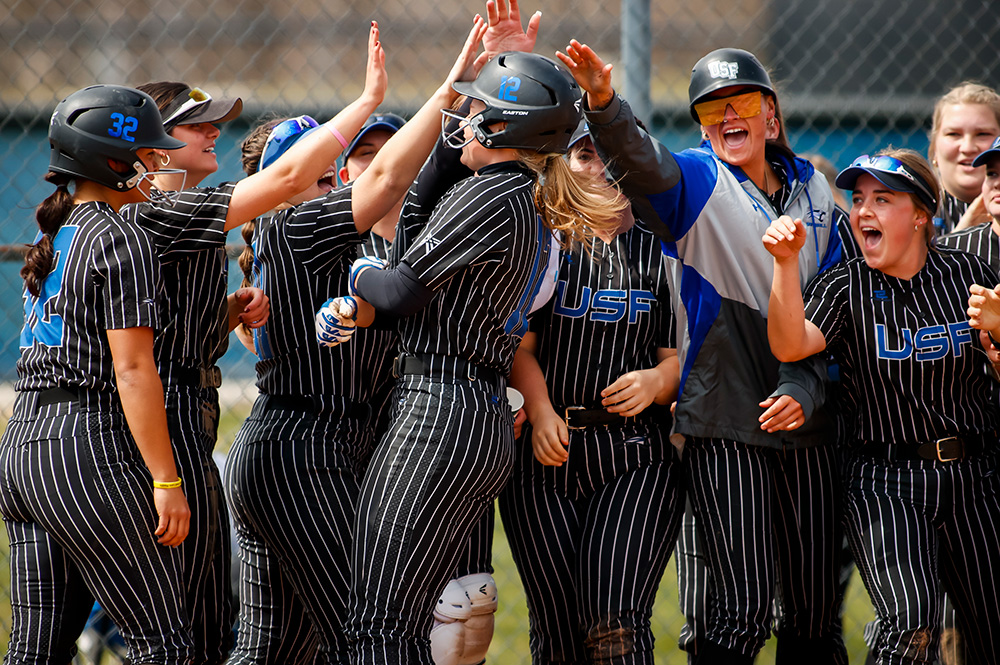 Softball team celebrating